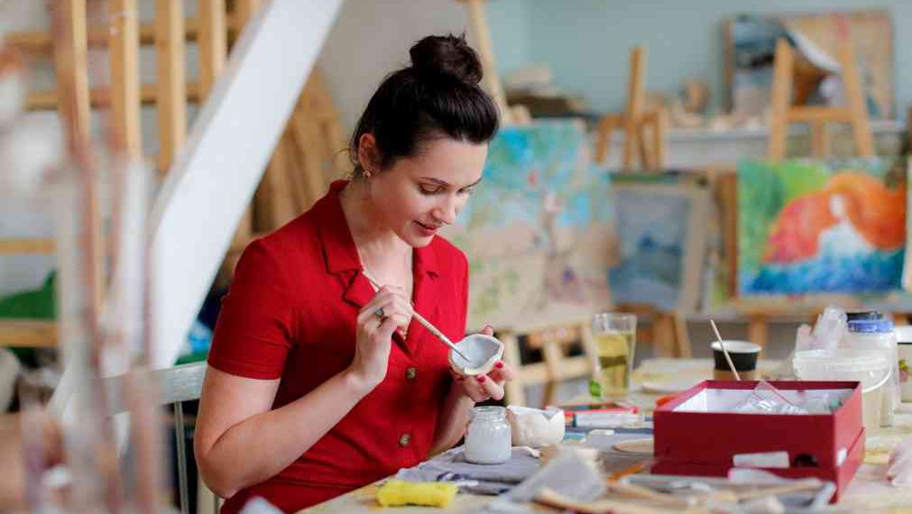 Enamel paints on a cup of clay